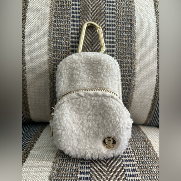 lululemon athletica Handbags - ✨LULULEMON Athletica Nano Clip-On
Fleece Backpack Light Ivory